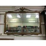 A reproduction gilt wood bevel glass regency design wall mirror