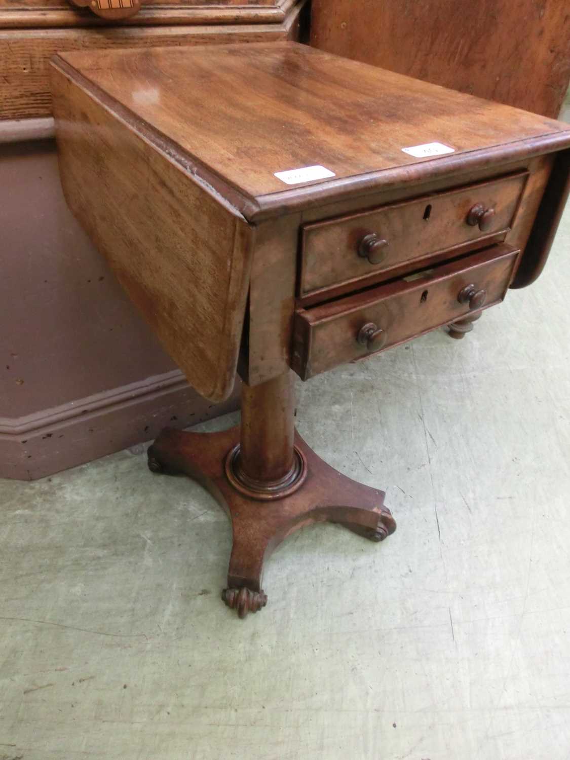 A Victorian mahogany drop-leaf work table having two full length drawersSplit to base of top drawer.