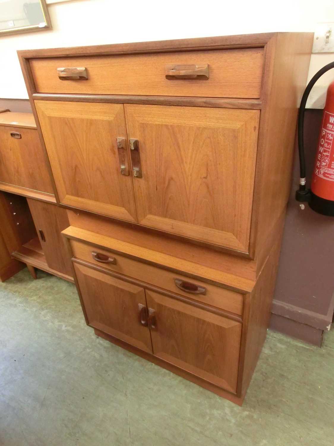 A pair of teak G Plan cabinets with two doors and free storage