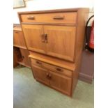 A pair of teak G Plan cabinets with two doors and free storage