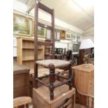 A 19th century oak and rush seat high back chair