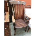 A Victorian beech and elm seat Windsor armchair