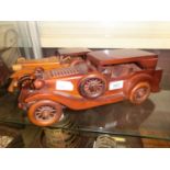 Two wooden models of vintage cars