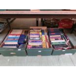 Three trays of assorted hardback books to include antiques