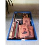 A tray containing various books