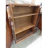 An oak 4' 6" high open bookcase