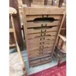 A late Victorian oak tamber door office unit enclosing ten internal drawersTamber fully