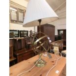 A brass finish table lamp with shade