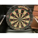 A Winmau dart board