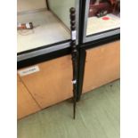 A carved African ebony walking cane