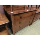 An early 20th century oak chest of three long drawers