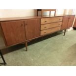 A mid-20th century teak sideboard by EverestMinor knocks and scratches throughout. No apparent major