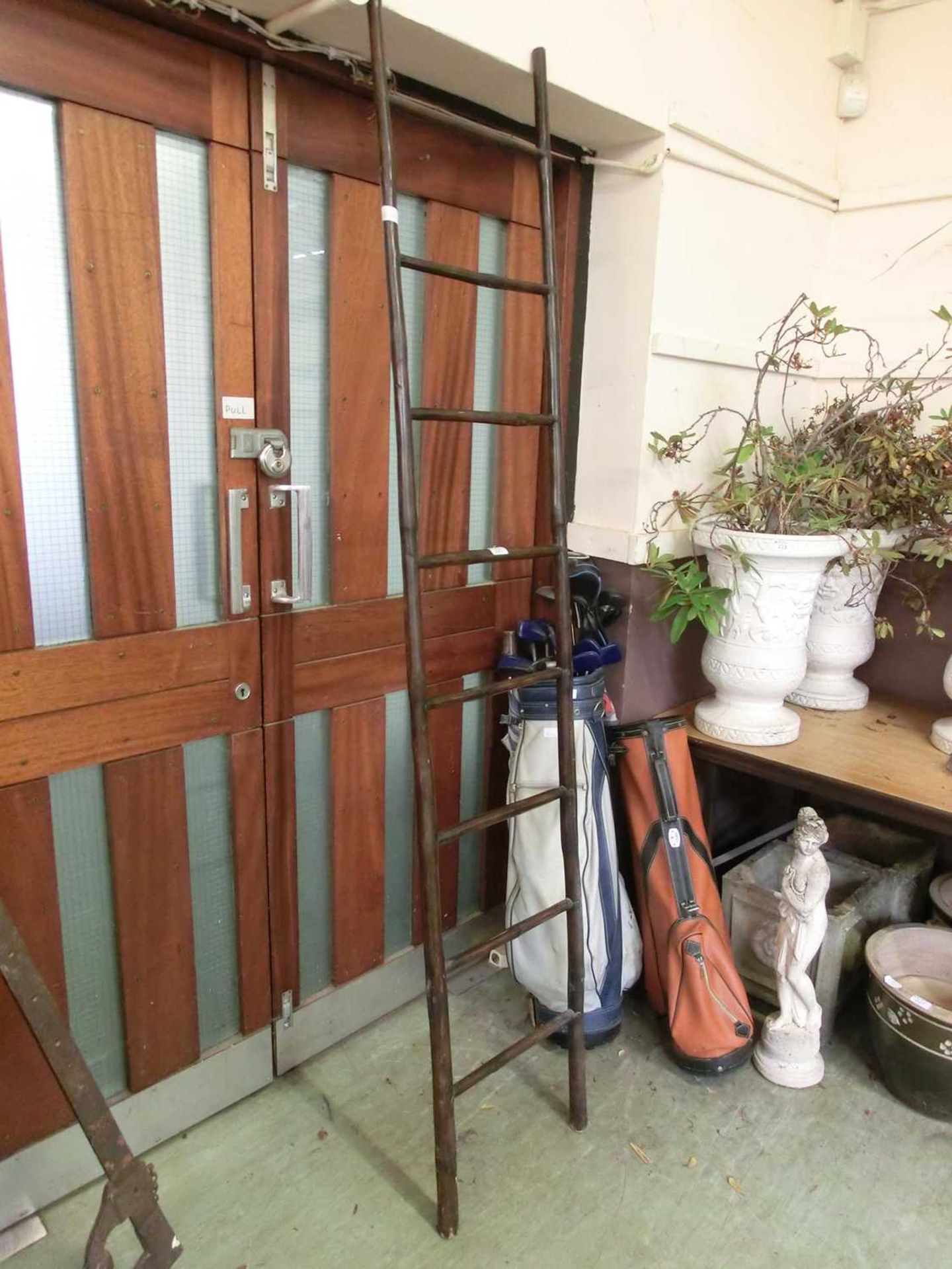 A modern clothes hanger in the form of a ladder