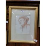 A framed and glazed pastel of girl's head initialled B.S