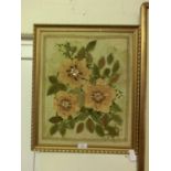 A gilt framed multimedia artwork of flowers