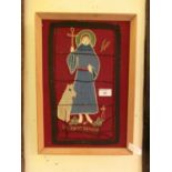 A framed material artwork depicting St Francis