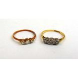 Two yellow metal and diamond trilogy rings marked '18ct & plat'. Approx. weight 3g