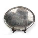 A George III silver oval tray, the central cartouche engraved with coat of arms. Hallmarked for