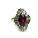 A yellow metal, ruby and baguette cut diamond cluster ring marked '14k'. Approx. weight 4g. Size O