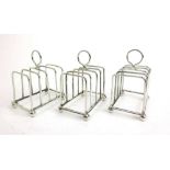 A set of three George V silver toast racks. Hallmarked for Chester 1922. Approx. weight 157g, h. 8.5