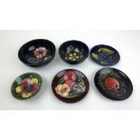 Three small Moorcroft bowls together with three Moorcroft pin dishesSeveral pieces with chips/