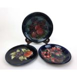 A Moorcroft Bird and Fruit pattern plate together with one other and an Anemone pattern bowl, max