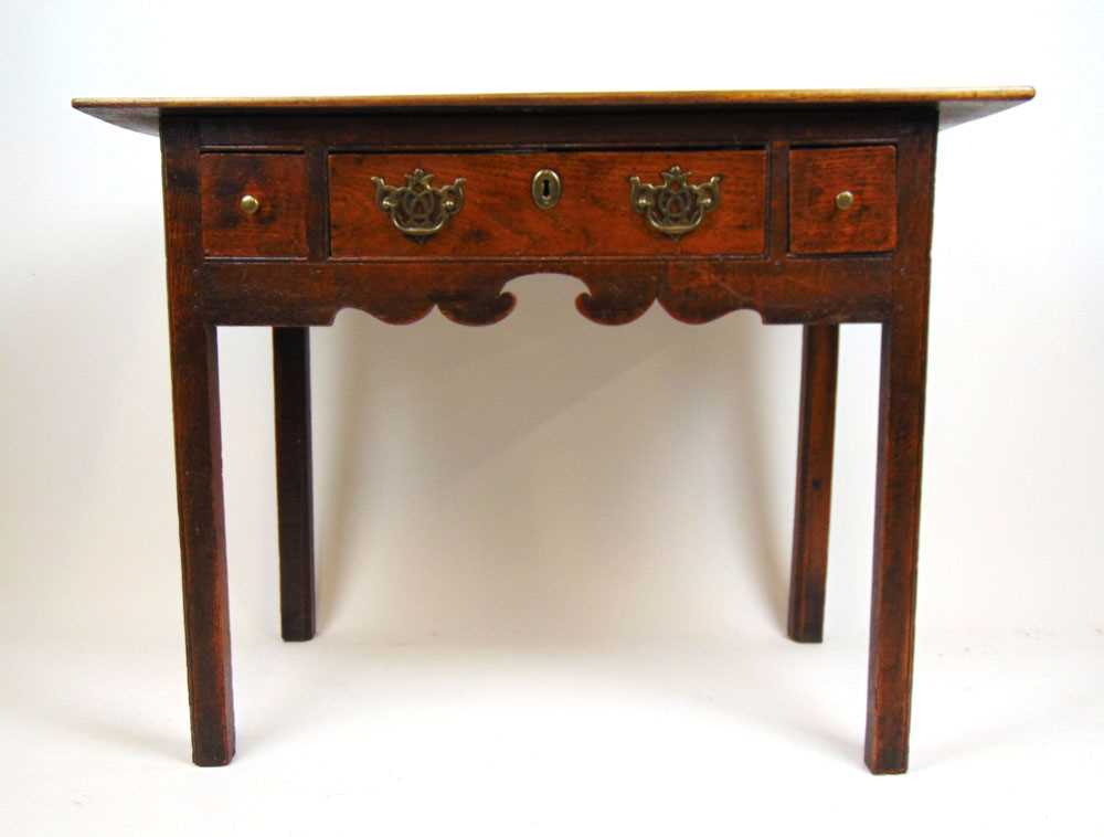 An 18th century and later oak side table, the later top over three drawers and a shaped apron on - Bild 2 aus 3