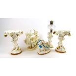 A pair of Moore Bros. cherub column comports, a Moore Bros. posy vase and two similar pieces (5)