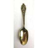 A continental white metal gilt tablespoon with ornate mask handle. Marks probably Nuremberg 18th