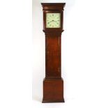 An 18th century oak long case clock, the enameled face with Roman numerals, pierced hands and a