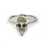 A white metal marquise cut diamond solitaire ring marked '750'. The stone approximately 1ct. Approx.