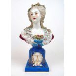A Dresden ceramic bust of Marie Antoinette (?) on a blue and gilt plinth, h. 37 cmSome petals