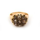 A Victorian yellow metal and diamond cluster ring, the stones totaling approximately 1.25 ct,