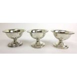 A set of three George III silver pedestal salts. Hallmarked for London 1815, makers mark for