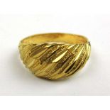 A yellow metal engraved dress ring. Approx. weight 4.2g. Size O A/F