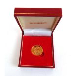 A Queen Elizabeth II gold full sovereign dated 2014. In presentation box