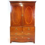 An Edwardian mahogany, satinwood banded and boxwood strung linen press, the dental cornice over