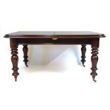 A reproduction 19th century style mahogany extending dining table, the moulded top with two extra