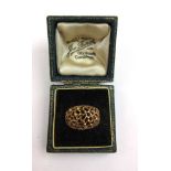 A 9ct gold dress ring of openwork design. Approx. weight 3.3g. Size L.With box