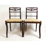A pair of Regency simulated rosewood and brass mounted side chairs, the bobbin turned top, back