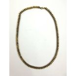 A yellow metal belcher and ball link necklace