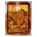 A large early 20th century Indian marquetry panel of a stalking tiger, h. 133 cm x 103 cm. Ivory