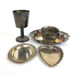 A selection of silver items to include an Irish silver goblet, pin dishes, embossed bowl etc.