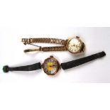 A rotary ladies watch with a 9ct gold strap along with a 9ct gold cased watch