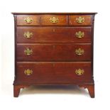 A mid 18th century oak chest of drawers, three short drawers over three graduated drawers flanked by