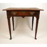 An 18th century oak single drawer freestanding table, the moulded top over shaped aprons on turned