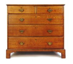 An 18th century oak chest of two short over three graduated drawers on bracket feet, h. 100 cm, w.