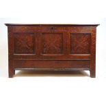 An 18th century oak mule chest, the top lifting to reveal a vacant interior with candle box over the