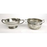 An Edwardian silver porringer together with a George V silver porringer. Various hallmarks.