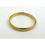 A 22ct gold wedding band. Approx. weight 2g. Size P